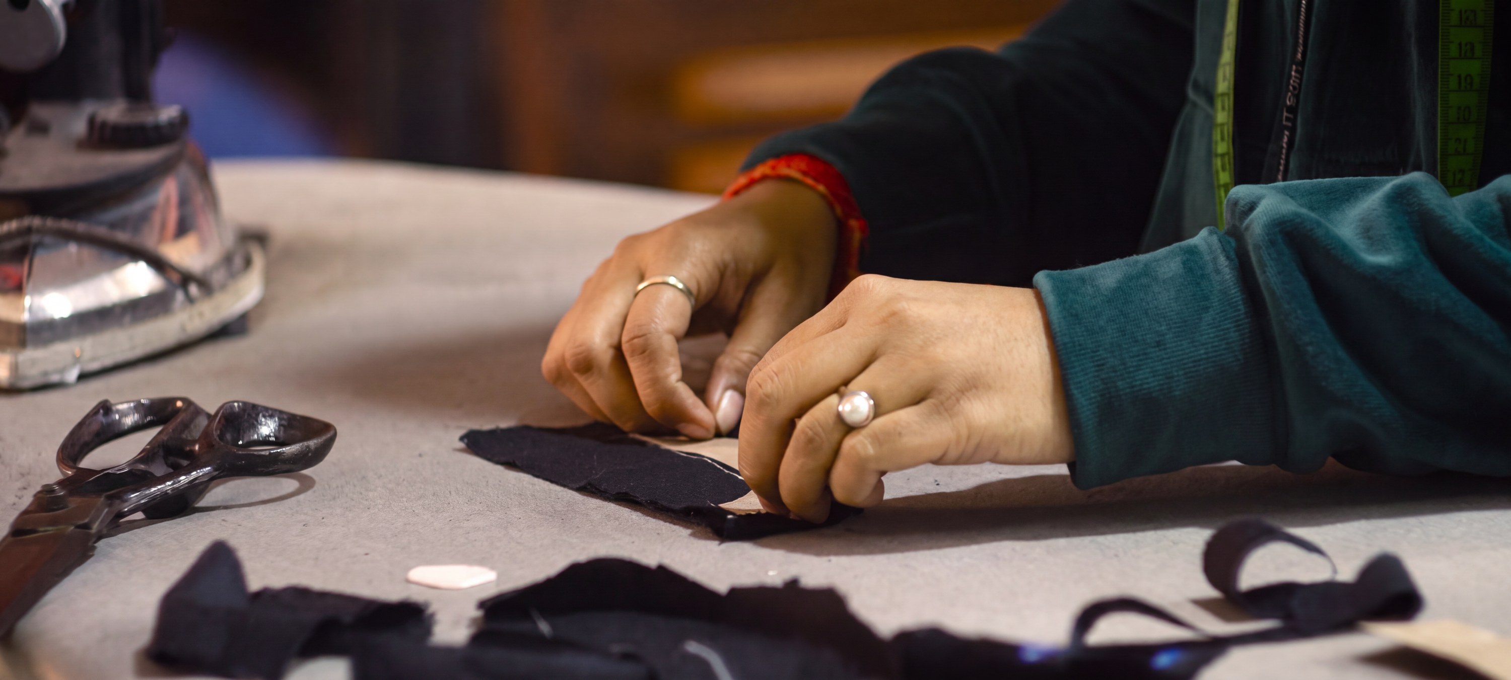 Cutting and marking fabric at the Women Fiber to Fashion unit in New Delhi